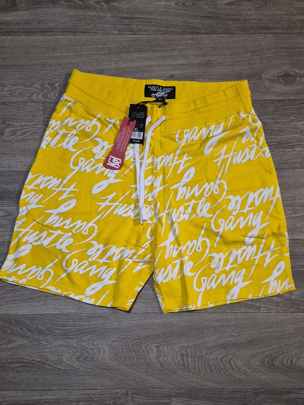 Hustle Gang Yellow Script Swim Shorts with White Print